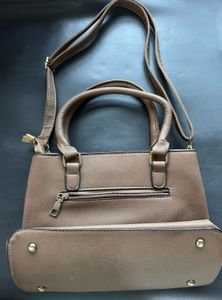 Stylish Taupe Handbag with Perforated Design
