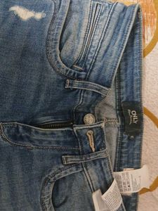 Distressed Blue Denim Jeans