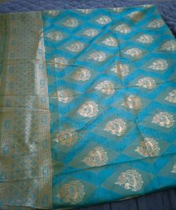 Elegant Teal Saree with Gold Brocade