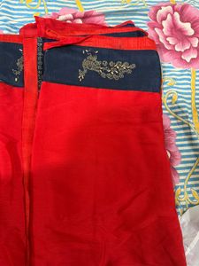 Stunning Red Saree with Peacock Embellishments