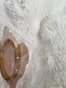 Elegant Gold Bangle with Crystals