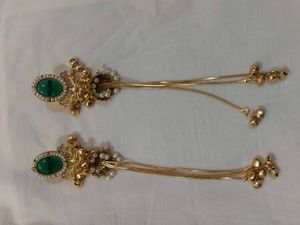 Exquisite Gold Jhumka Earrings with Green Stone