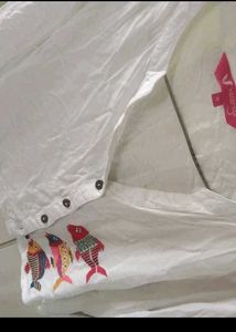 White Jeans and Embroidered Shirt