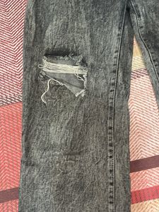 Acid washed distressed black oversized jeans