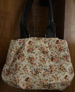 Chic Floral Handbag with Black Accents