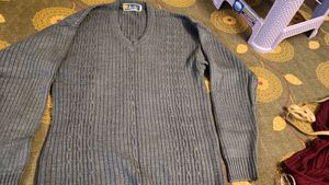 Gray V-Neck Knit Sweater and curtain