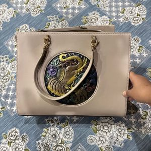 Elegant Beige Handbag with Elephant Motif