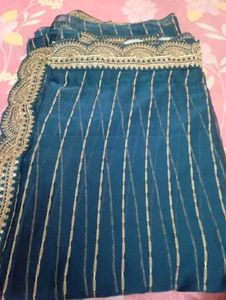 Elegant Teal Saree with Golden Stripes