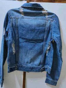 Distressed Denim Jacket with Pink Lace-Up Detail