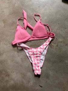 tri-bralette style bikini top and pink bot