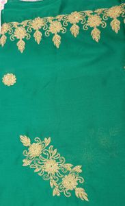 Dark green golden embroidery fabric with work on both sides (upper part and bottom part both have golden embroidery work), patches of work in between.7 meter cloth.