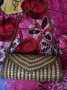 Elegant Gold Embellished Clutch
