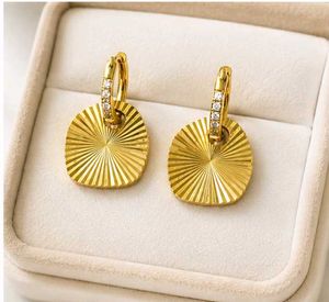Gold Sunburst Dangle Earrings