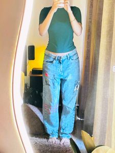 Womens Blue Jeans and green fitted top