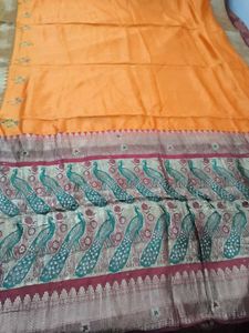 Beautiful Orange Silk Saree with Peacock Border