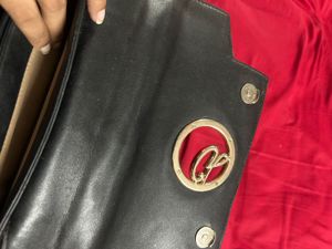 Chic Black Handbag with Gold G Logo