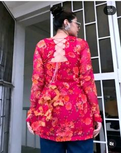 pink kurti with lining and lots of tussels