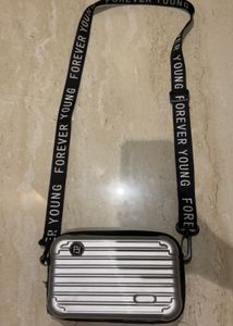Convertible Silver Mini Luggage Style Clutch.
