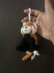 cute red panda plush keychain with a white