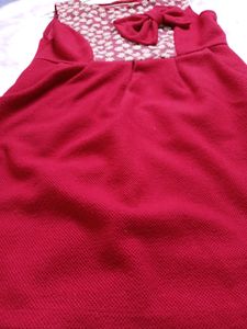 Free Delivery red dress with lace and bow detail.