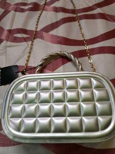 Elegant Silver Clutch with Gold Chain