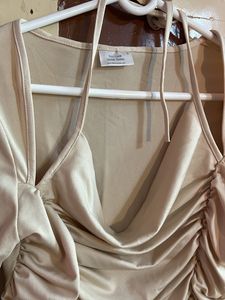 beige top with unique and catchy neckline