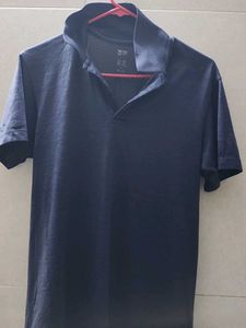 Uniqlo Men's Navy Blue Polo Shirt