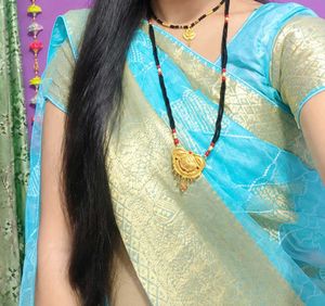 Elegant Teal Saree with white Diamond type Pattern