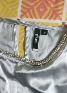 Stylish Silver Top with Embellished Neck