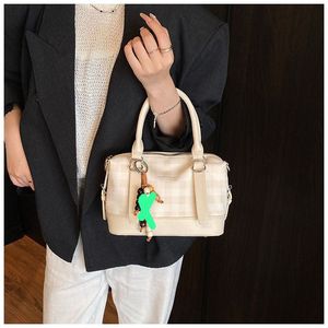 Chic Pink Plaid Handbag with Charm