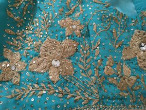 Turquoise Saree with Gold Embellishments