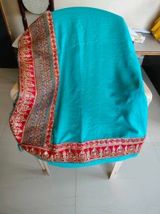 Elegant Teal Saree with Embroidered Border