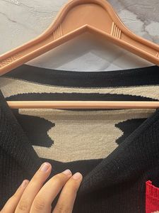 Black Sweater with Red Pocket Detail