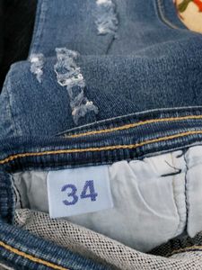 Distressed Blue Denim Jeans