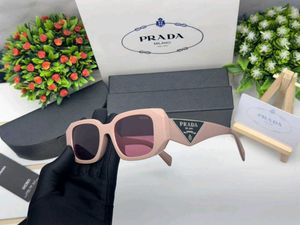 Prada Sunglasses - Chic Pink Tinted Lenses