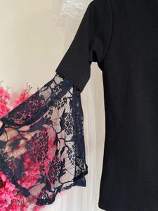 Elegant Black Top with Lace Bell Sleeves