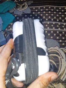 a sling bad in black or white colour