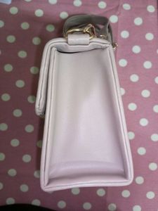 Stylish Beige Handbag with “H” Logo