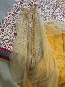 Ethnic yellow gown with shrug and dupatta