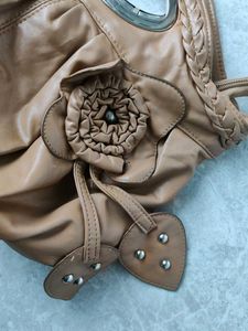 Chic Tan Leather Shoulder Bag with Flower Detail