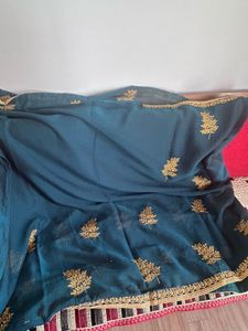 Elegant Teal Saree with Gold Embroidery