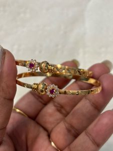 Elegant Gold Bangles with Ruby Accents