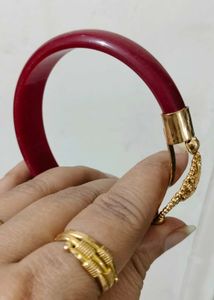 Brand new Gold Bangle with Red Accents