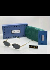 Gucci Oval Sunglasses Red Lens Gold Frame