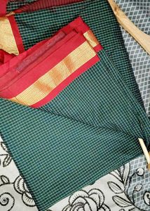 Elegant Green Saree with Red Border