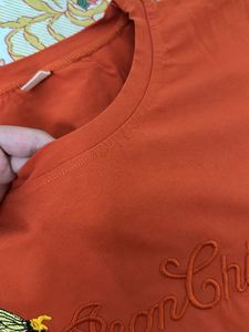 Basic Orange Top  With A Little Print In Center