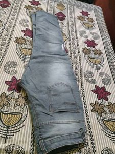Distressed Blue Denim Jeans
