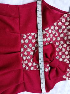 Free Delivery red dress with lace and bow detail.