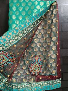 Elegant Teal Saree with Embellishments