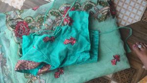 Beautiful mint green net  embroidered saree